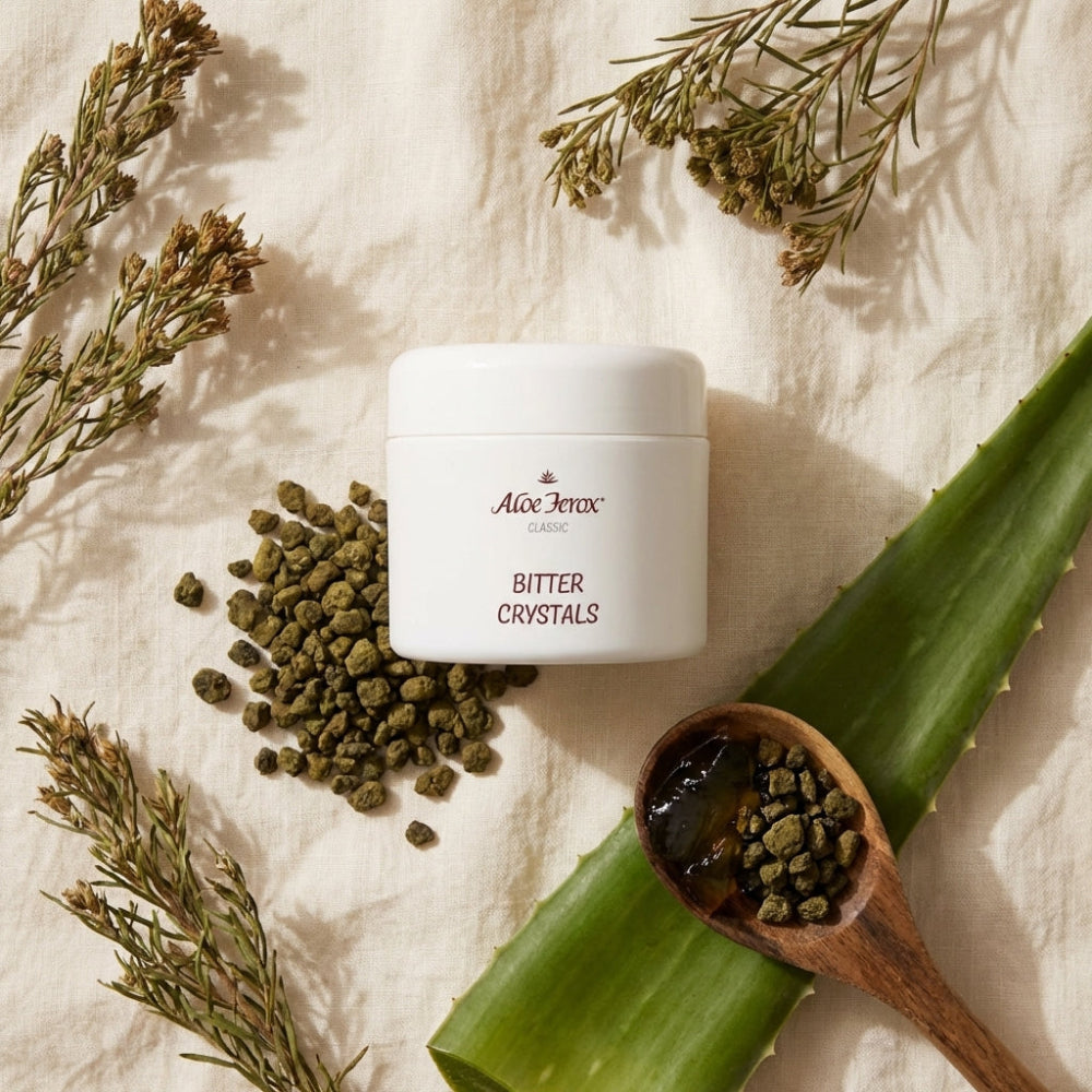 Aloe Ferox Bitter Crystals container with aloe leaf and herbs