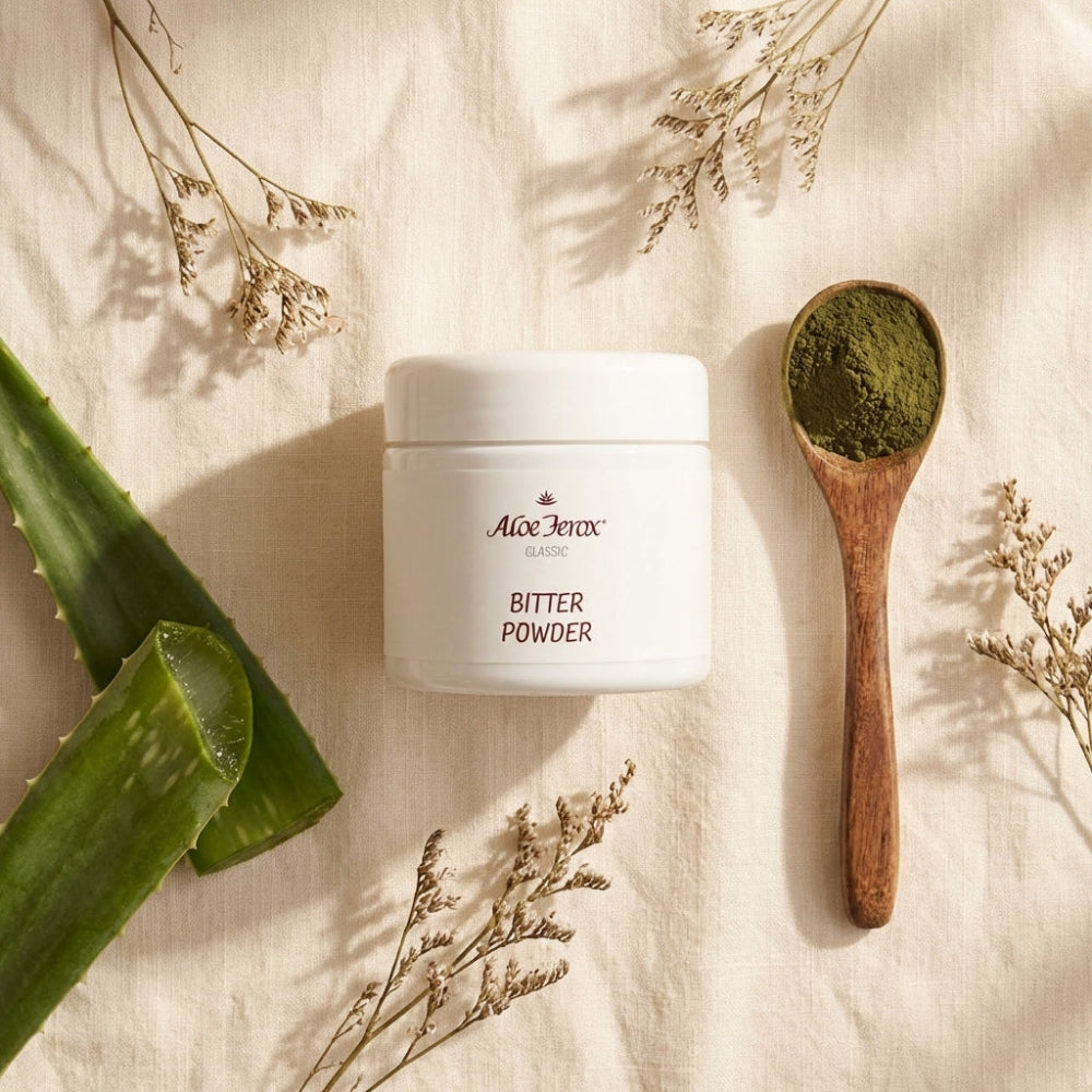 Aloe Ferox Bitter Powder with wooden spoon and aloe leaves